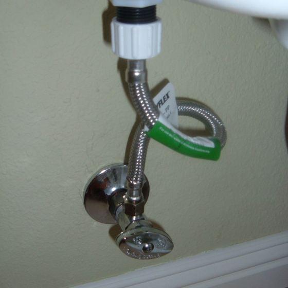 Tenant photo of the water shutoff valve behind the toilet